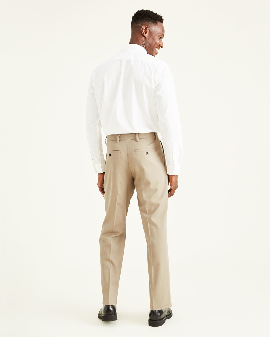 Back view of model wearing Timber Wolf Easy Khakis, Pleated, Classic Fit.