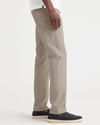 Side view of model wearing Timber Wolf Essential Chinos, Slim Fit.