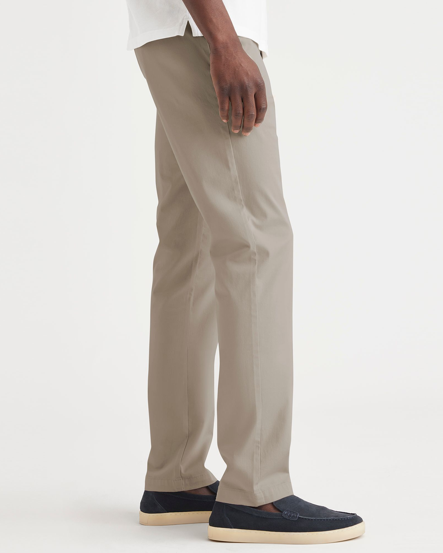 Side view of model wearing Timber Wolf Essential Chinos, Slim Fit.