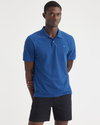 Front view of model wearing True Blue Rib Collar Polo, Slim Fit.