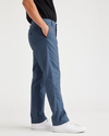 Side view of model wearing Vintage Indigo City Tech Trousers, Slim Fit.