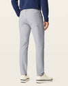 Back view of model wearing Sharkskin Go Airweave 5-Pocket, Slim Tapered Fit.