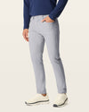 Side view of model wearing Sharkskin Go Airweave 5-Pocket, Slim Tapered Fit.