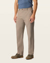 Side view of model wearing Dark Pebble Easy Khakis, Classic Fit.