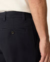 Side view of model wearing Navy Easy Khakis, Classic Fit.