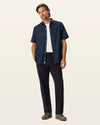 Front view of model wearing Navy Easy Khakis, Classic Fit.