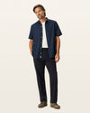 Front view of model wearing Black Easy Khakis, Classic Fit.