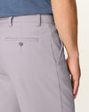 Side view of model wearing Burma Grey Easy Khakis, Classic Fit.