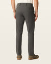 Back view of model wearing Storm Workday Khakis, Slim Fit.