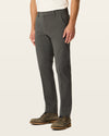 Side view of model wearing Storm Workday Khakis, Slim Fit.