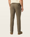 Back view of model wearing Dark Pebble Easy Khakis, Slim Fit.