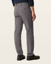 Back view of model wearing Storm Workday Khakis, Straight Fit.