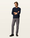 Front view of model wearing Storm Workday Khakis, Straight Fit.