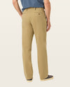 Side view of model wearing New British Khaki Workday Khakis, Classic Fit.