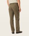 Side view of model wearing Dark Pebble Workday Khakis, Classic Fit.