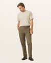 Front view of model wearing Dark Pebble Workday Khakis, Classic Fit.