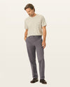 Front view of model wearing Storm Workday Khakis, Classic Fit.
