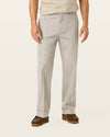 Side view of model wearing Cloud Signature Iron Free Khakis, Relaxed Fit with Stain Defender®.