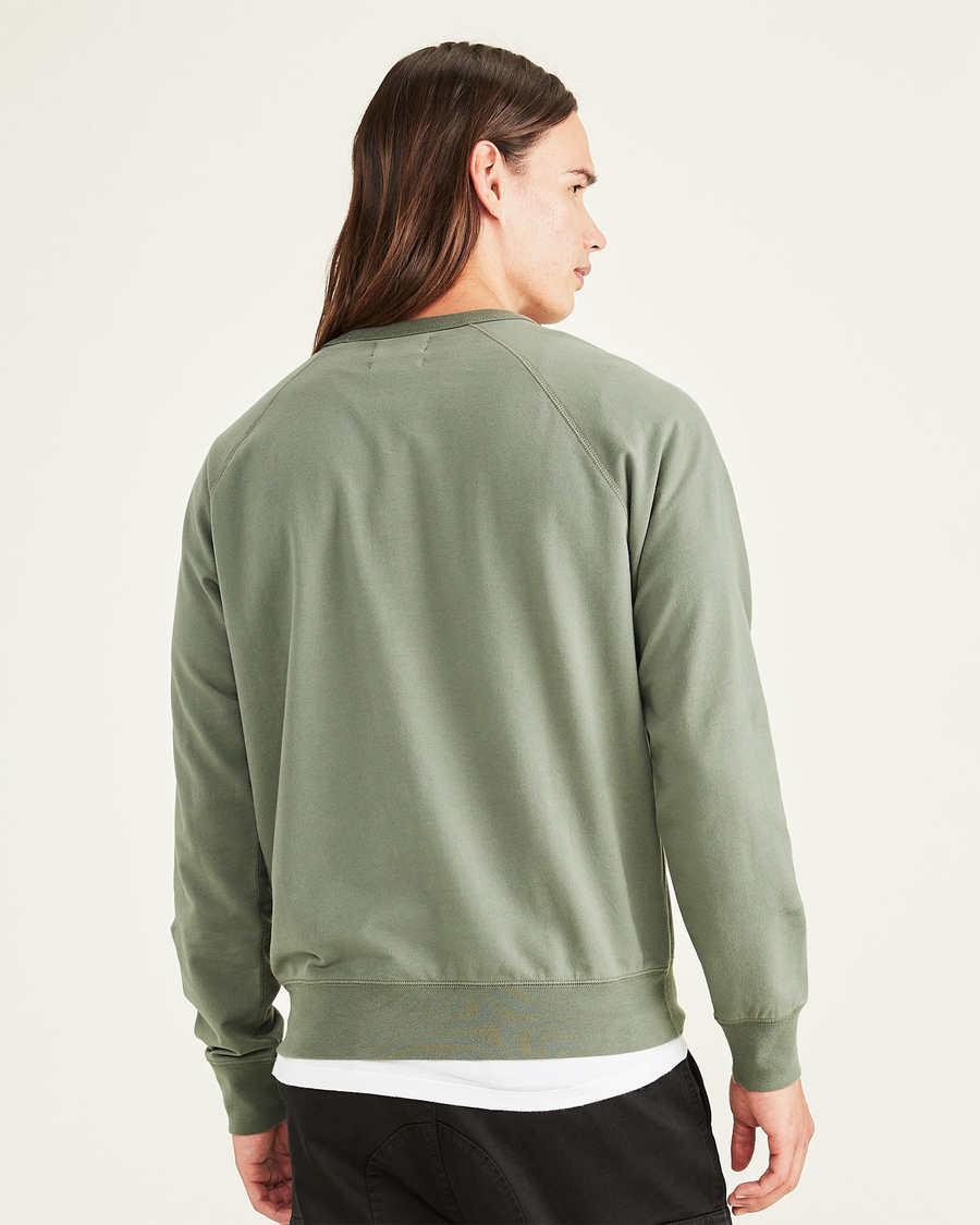 Back view of model wearing Agave Green Original Crewneck Sweatshirt, Regular Fit.