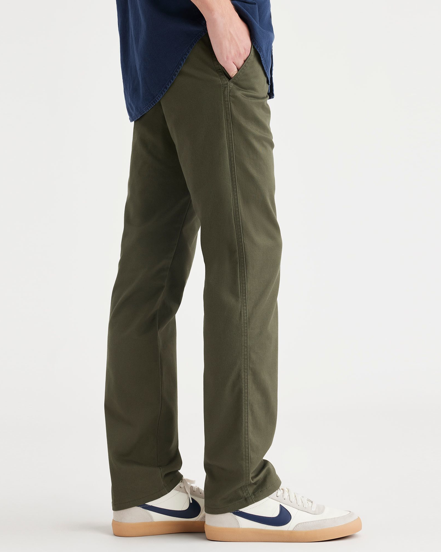Side view of model wearing Army Green Original Chinos, Slim Fit.