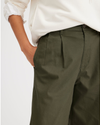View of model wearing Army Green Original Khakis, Pleated, High Wide Fit.
