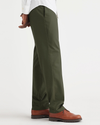 Side view of model wearing Army Green Signature Iron Free Khakis, Straight Fit with Stain Defender®.