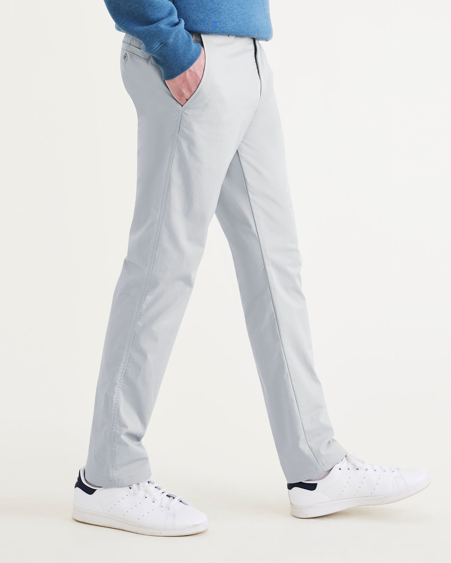 Side view of model wearing Ash Ultimate Chinos, Slim Fit.