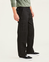 Side view of model wearing Beautiful Black Cargo Pants, Relaxed Fit.