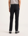 Back view of model wearing Beautiful Black Go Activeflex Chino, Slim Fit.