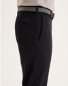 Side view of model wearing Beautiful Black Go Activeflex Chino, Slim Fit.