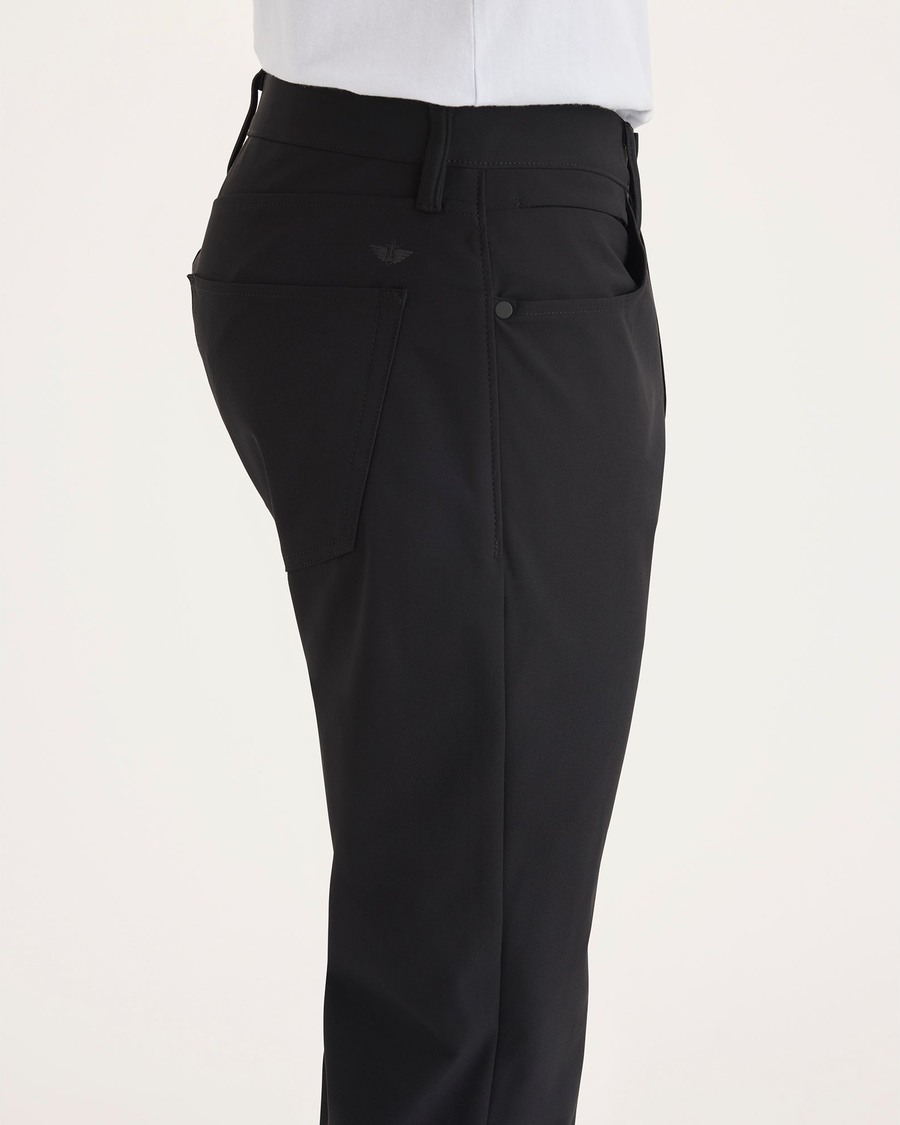 Side view of model wearing Beautiful Black Go Airweave 5-Pocket, Slim Tapered Fit.