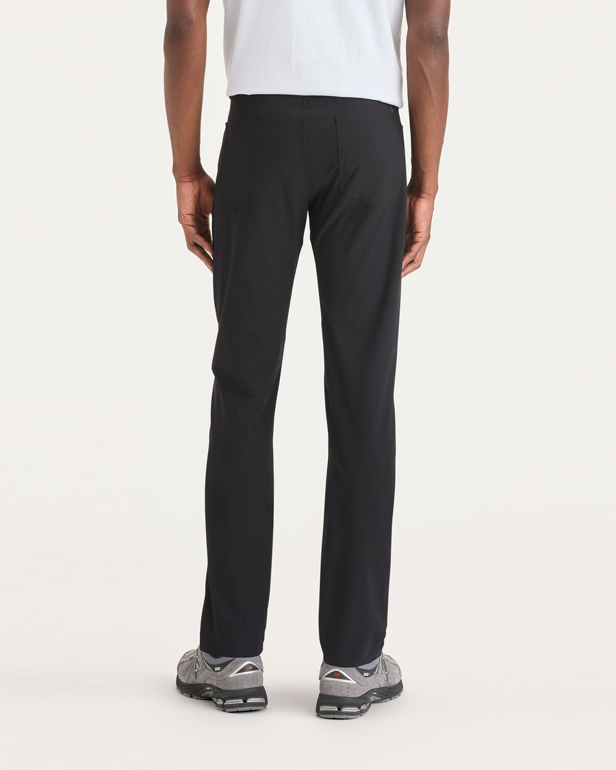 Back view of model wearing Beautiful Black Go Airweave Chino, Slim Tapered Fit.