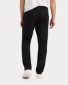 Back view of model wearing Beautiful Black Go Pro Pant with AceFlex, Slim Fit.