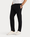 Side view of model wearing Beautiful Black Go Pro Pant with AceFlex, Slim Fit.