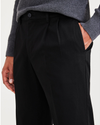 View of model wearing Beautiful Black Signature Iron Free Khakis, Pleated, Classic Fit with Stain Defender® (Big and Tall).