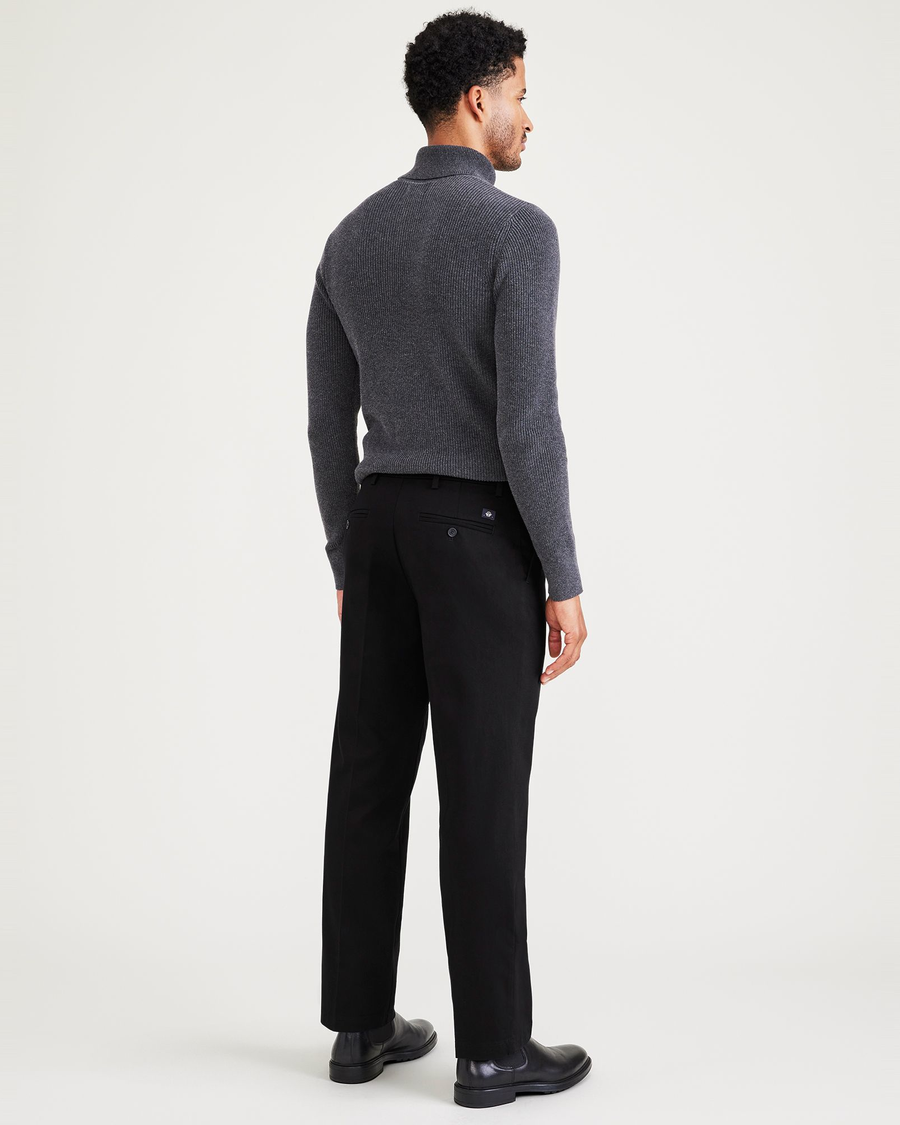 Back view of model wearing Beautiful Black Signature Iron Free Khakis, Pleated, Classic Fit with Stain Defender®.