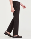 Side view of model wearing Black Bean City Tech Trousers, Straight Fit.