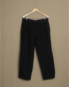 Front view of model wearing Black Black Overdyed Double Pleated Pants - 34 x 28.