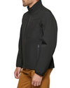 Side view of model wearing Black Chest Yoke Softshell Jacket.