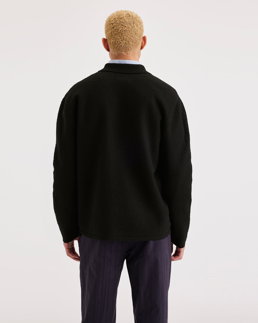 Back view of model wearing Black Chore Sweater, Regular Fit.