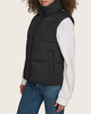 View of model wearing Black Hooded Matte Bubble Puffer Vest.