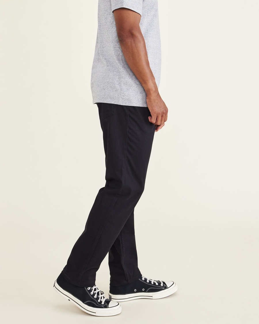 Side view of model wearing Black Jean Cut Pants, Athletic Fit.