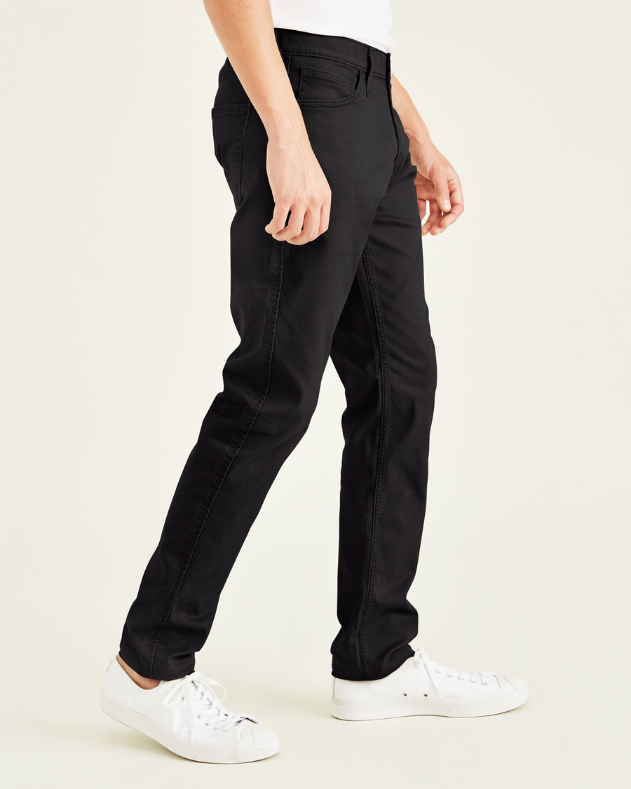 Side view of model wearing Black Jean Cut Pants, Slim Fit.
