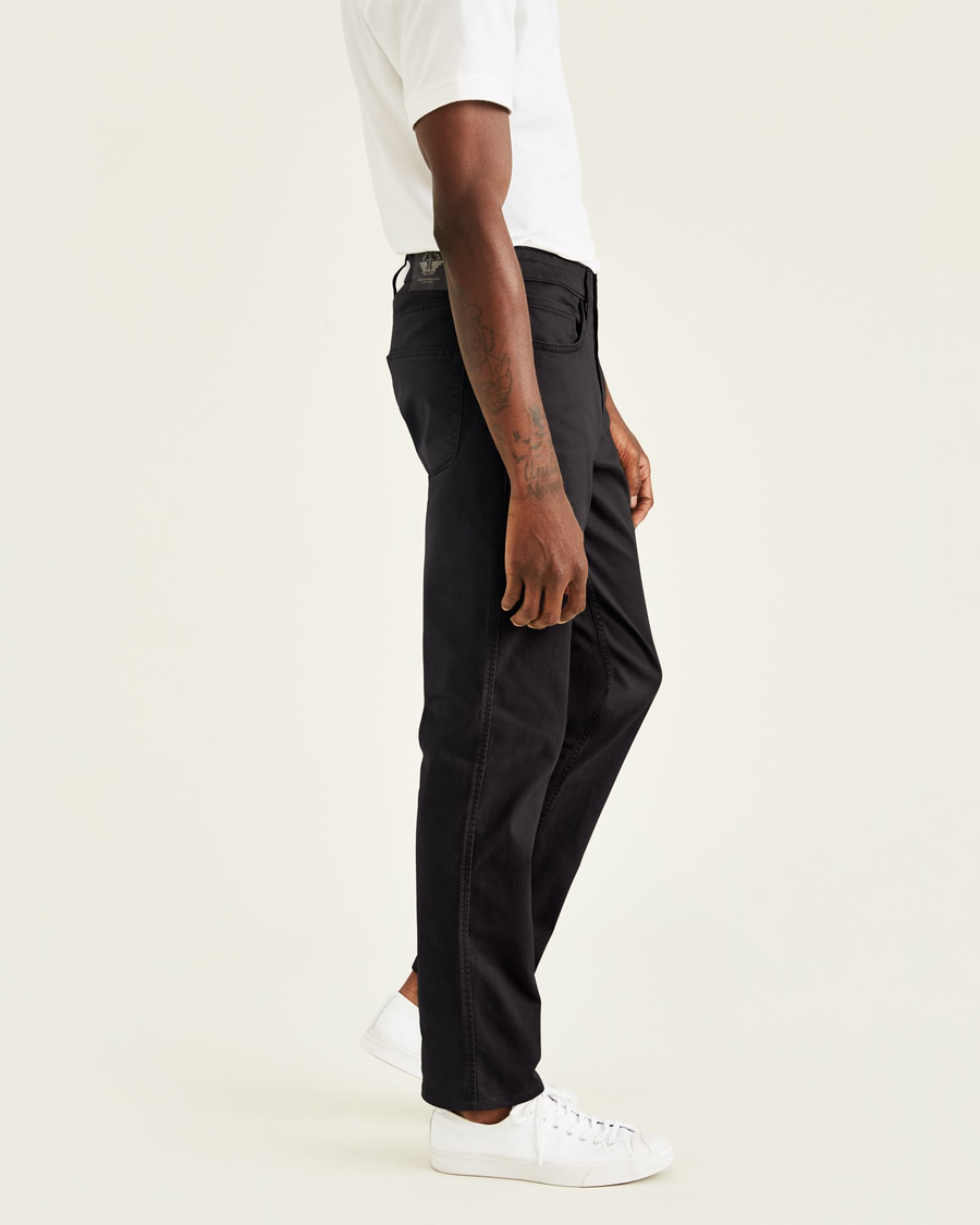 Side view of model wearing Black Jean Cut Pants, Straight Fit.
