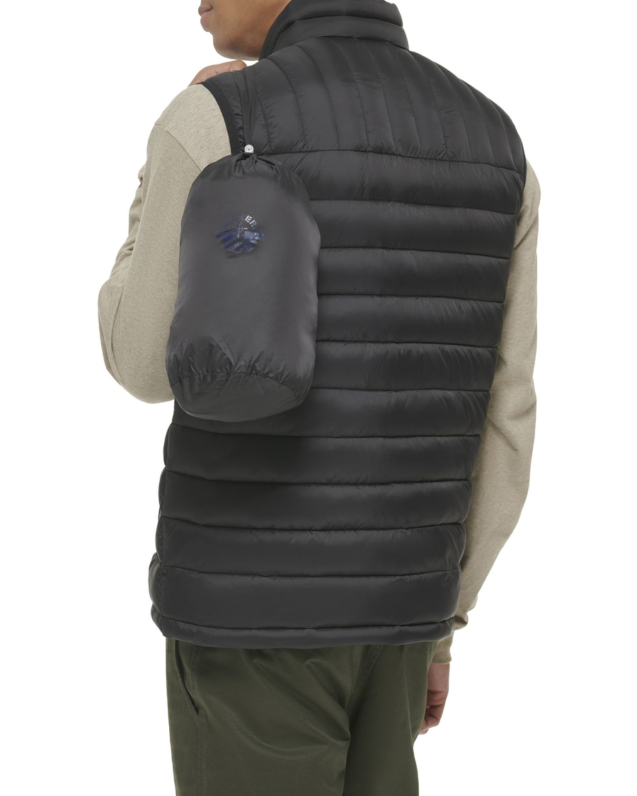 Back view of model wearing Black Lightweight Nylon Packable Vest.