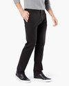 Side view of model wearing Black Motion Chinos, Tapered Fit (Big and Tall).