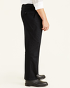 Side view of model wearing Black Signature Khakis, Pleated, Classic Fit (Big and Tall).