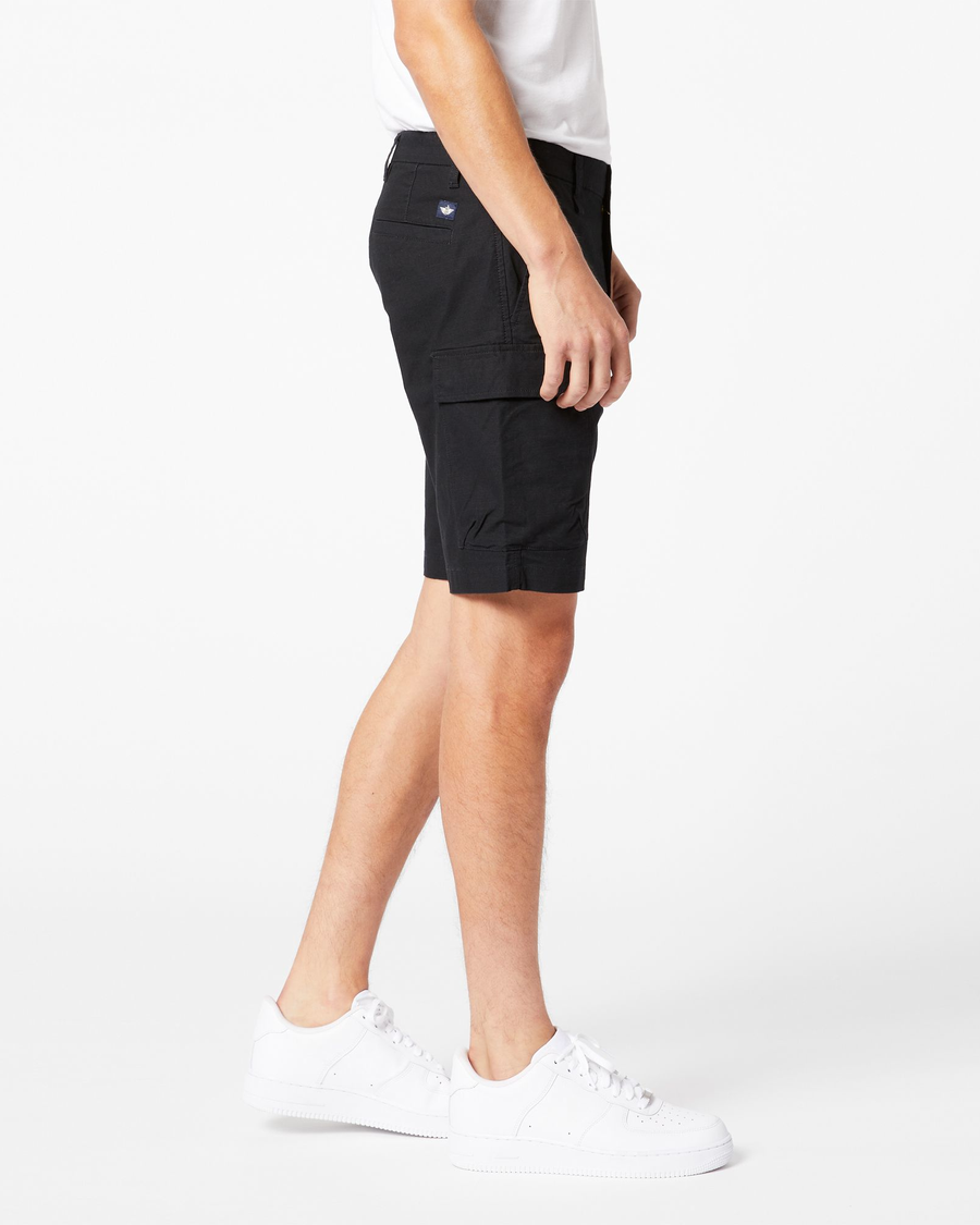 Side view of model wearing Black Tech Cargo 9" Shorts.