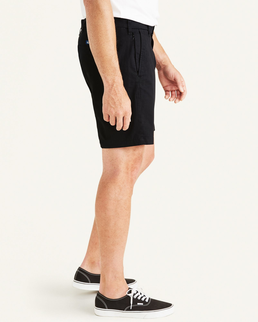 Side view of model wearing Black Ultimate 9.5" Shorts (Big and Tall).