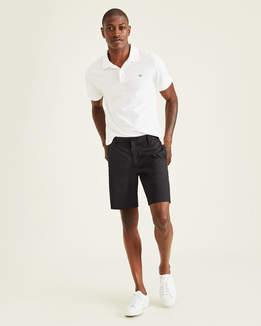 Front view of model wearing Black Ultimate 9.5" Shorts, Straight Fit.